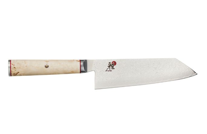 A sleek, high-quality kitchen knife with a patterned blade and a light-colored handle, featuring a decorative emblem.